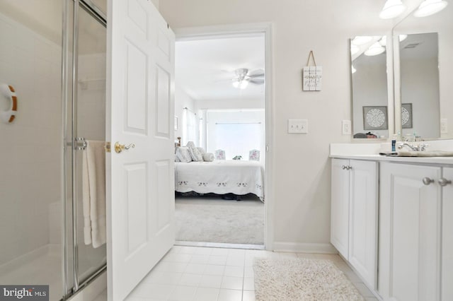 1009 Samantha Ln Unit 302, Odenton, MD 21113 - ensuite bathroom with a ceiling fan, vanity, a shower stall, tile patterned flooring, and baseboards