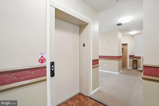 1009 Samantha Ln Unit 302, Odenton, MD 21113 - corridor featuring carpet floors, elevator, and baseboards