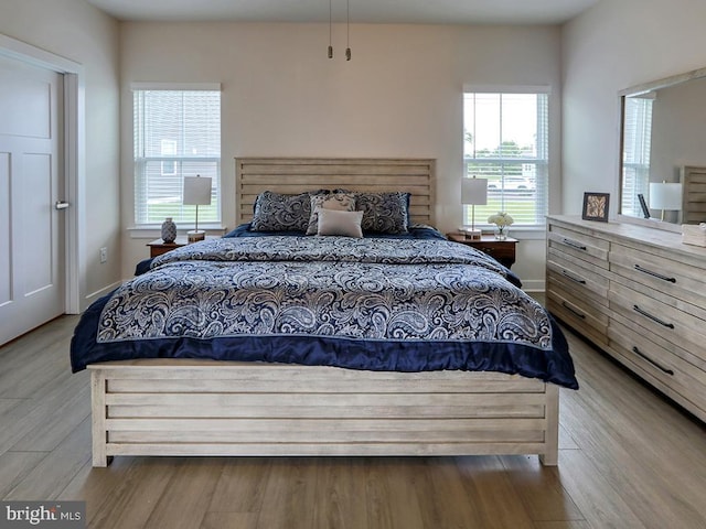 bedroom featuring wood finished floors
