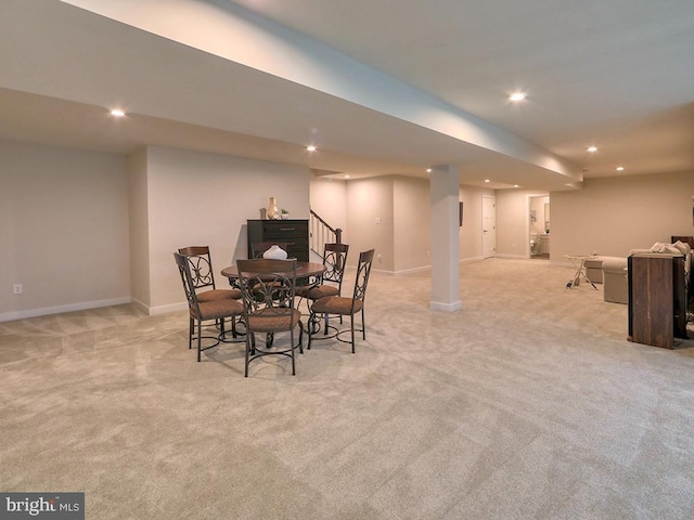 dining space with light carpet, recessed lighting, and baseboards