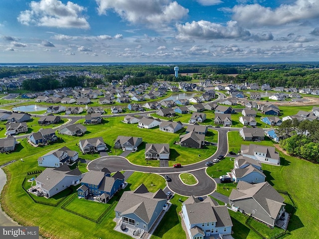 aerial perspective of suburban area featuring a large body of water