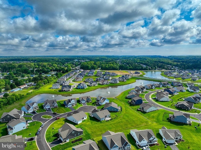 aerial view of residential area with a nearby body of water