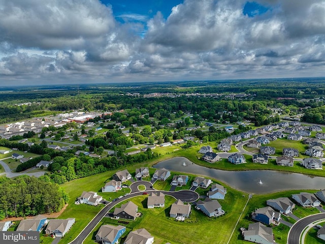 aerial perspective of suburban area with a nearby body of water