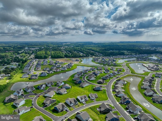 aerial perspective of suburban area with a large body of water