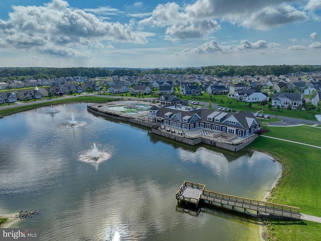 aerial perspective of suburban area with a nearby body of water