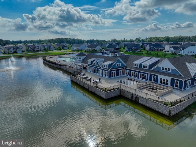 aerial perspective of suburban area with a nearby body of water