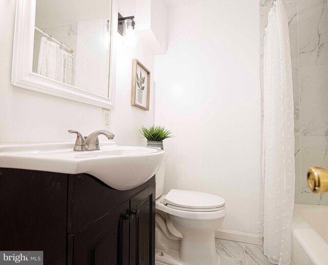3565 Benzinger Rd, Baltimore, MD 21229 - full bathroom with marble finish floors, toilet, vanity, and baseboards