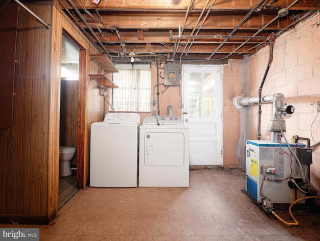 3565 Benzinger Rd, Baltimore, MD 21229 - basement with separate washer and dryer, electric panel, a heating unit, tile patterned floors, and concrete block wall