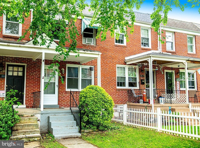 3565 Benzinger Rd, Baltimore, MD 21229 - multi unit property featuring covered porch, brick siding, and fence