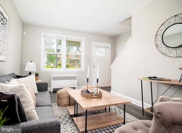 3565 Benzinger Rd, Baltimore, MD 21229 - living area with radiator heating unit, baseboards, and wood finished floors
