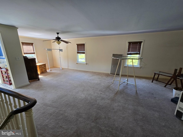 26689 Mariners Rd, Crisfield, MD 21817 - unfurnished living room featuring ceiling fan, healthy amount of natural light, and baseboards