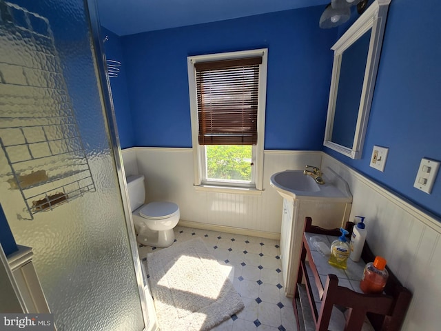 26689 Mariners Rd, Crisfield, MD 21817 - bathroom with a wainscoted wall, toilet, tile patterned floors, and vanity