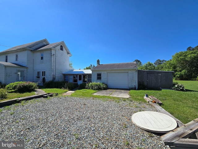 26689 Mariners Rd, Crisfield, MD 21817 - rear view of property with an attached garage, a yard, and driveway