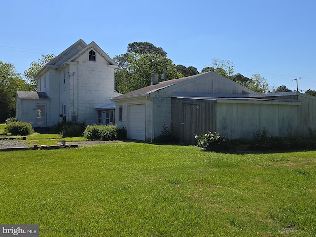 26689 Mariners Rd, Crisfield, MD 21817 - back of house featuring a yard and an attached garage