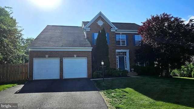 9226 Campfire Ct, Bristow, VA 20136 - view of front of home featuring driveway, brick siding, and a garage