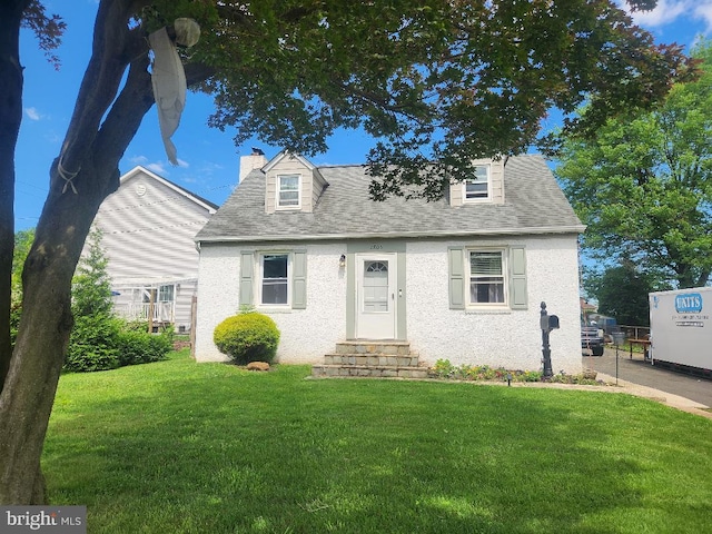 2803 New Falls Rd, Levittown, PA 19056 - new england style home featuring a front lawn, entry steps, roof with shingles, and a chimney