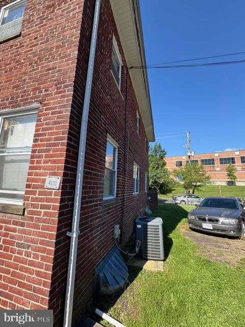 4610 6th St SE, Washington, DC 20032 - view of side of home with brick siding and a yard
