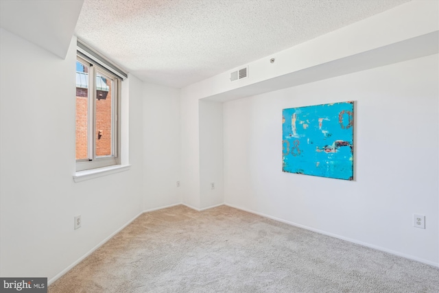 1001 N Vermont St Unit 812, Arlington, VA 22201 - empty room with carpet flooring, a textured ceiling, and baseboards