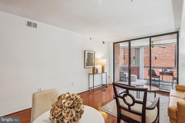 1001 N Vermont St Unit 812, Arlington, VA 22201 - living room with floor to ceiling windows, a textured ceiling, wood finished floors, and ceiling fan