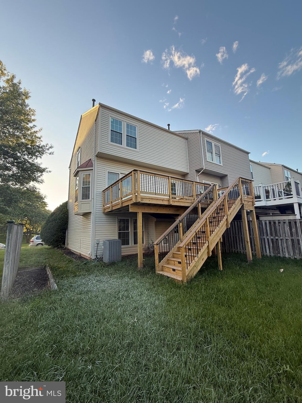 43212 Chokeberry Sq, Ashburn, VA 20147 - rear view of house with stairs, a wooden deck, a yard, and cooling unit