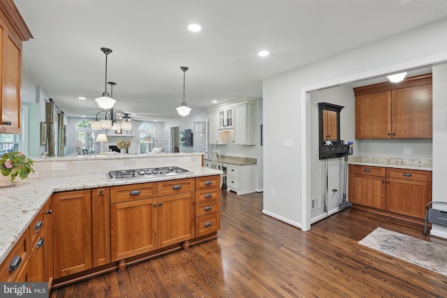 8346 Argent Cir, Fairfax Station, VA 22039 - kitchen featuring a peninsula, dark wood-style flooring, stainless steel gas stovetop, open floor plan, and light stone countertops