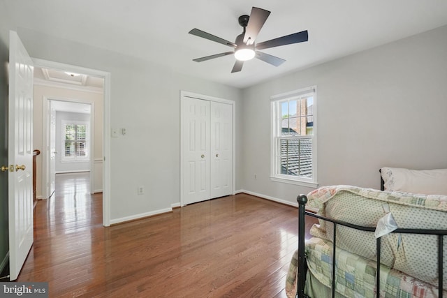 8346 Argent Cir, Fairfax Station, VA 22039 - bedroom featuring multiple windows, baseboards, wood finished floors, and a closet