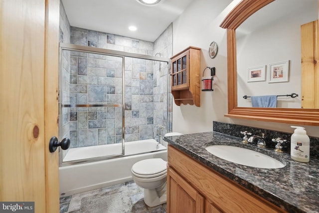 8346 Argent Cir, Fairfax Station, VA 22039 - full bath with vanity, toilet, combined bath / shower with glass door, stone finish floors, and recessed lighting
