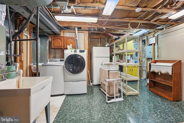 8346 Argent Cir, Fairfax Station, VA 22039 - unfinished below grade area featuring separate washer and dryer, tile patterned floors, freestanding refrigerator, and a sink