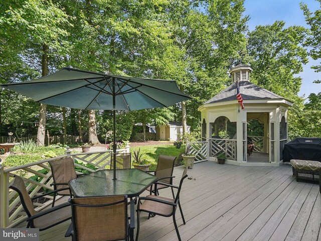 8346 Argent Cir, Fairfax Station, VA 22039 - wooden deck with outdoor dining space, grilling area, and a gazebo