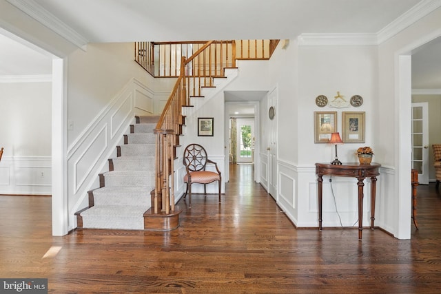 8346 Argent Cir, Fairfax Station, VA 22039 - entrance foyer with a decorative wall, stairway, wood finished floors, crown molding, and wainscoting