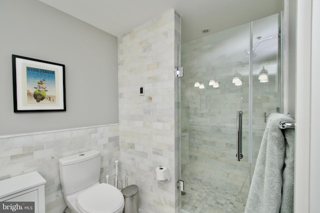 2818 Connecticut Ave NW Unit 503, Washington, DC 20008 - bathroom featuring toilet, tile walls, vanity, and a stall shower