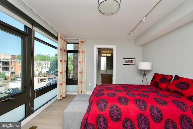 2818 Connecticut Ave NW Unit 503, Washington, DC 20008 - bedroom with wood finished floors, track lighting, and ensuite bathroom