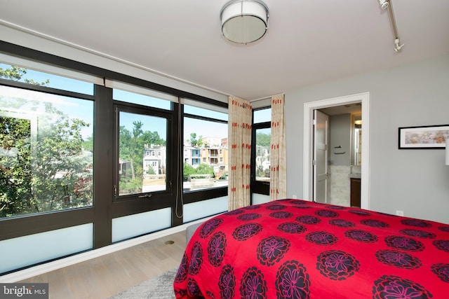 2818 Connecticut Ave NW Unit 503, Washington, DC 20008 - bedroom with wood finished floors, access to outside, and ensuite bath