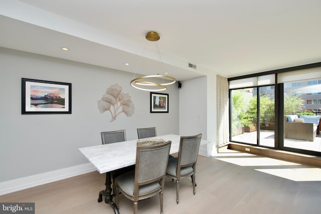 2818 Connecticut Ave NW Unit 503, Washington, DC 20008 - dining area featuring light wood finished floors, baseboards, and recessed lighting