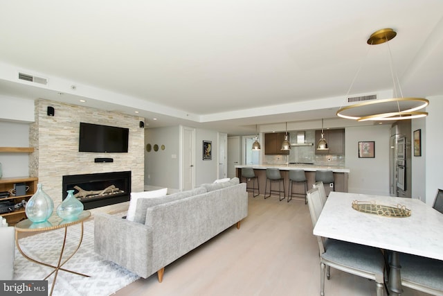 2818 Connecticut Ave NW Unit 503, Washington, DC 20008 - living area featuring light wood-style flooring, a large fireplace, and recessed lighting