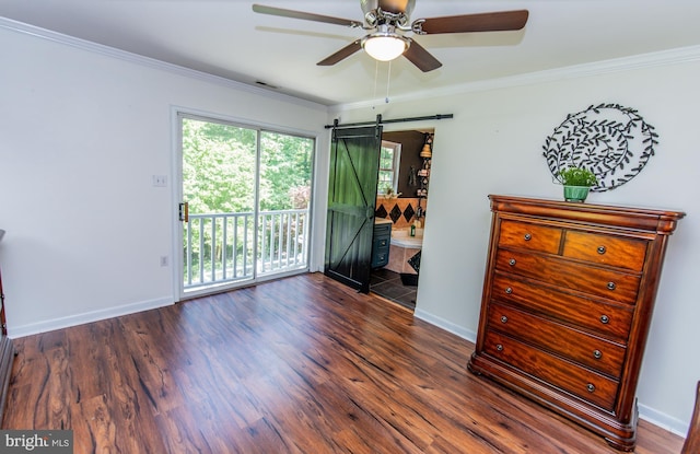 6300 Mallard Ln, Lothian, MD 20711 - spare room featuring a barn door, a ceiling fan, wood finished floors, ornamental molding, and baseboards