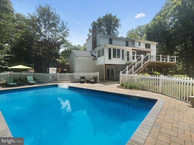 6300 Mallard Ln, Lothian, MD 20711 - view of pool featuring stairs, a wooden deck, a fenced backyard, and a patio