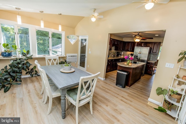 6300 Mallard Ln, Lothian, MD 20711 - dining area featuring a ceiling fan, lofted ceiling, light wood finished floors, and baseboards
