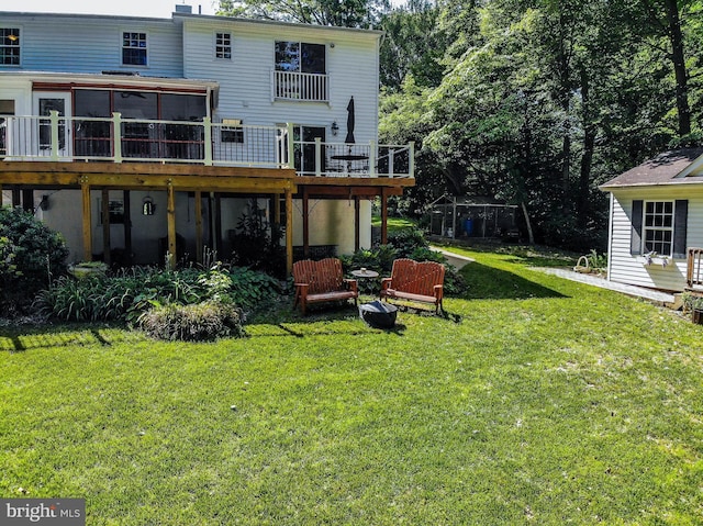6300 Mallard Ln, Lothian, MD 20711 - back of property with a yard, a wooden deck, and a sunroom