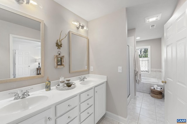 3080 Morewood Ln, Charlottesville, VA 22901 - full bathroom with tile patterned flooring, double vanity, a shower stall, and a garden tub