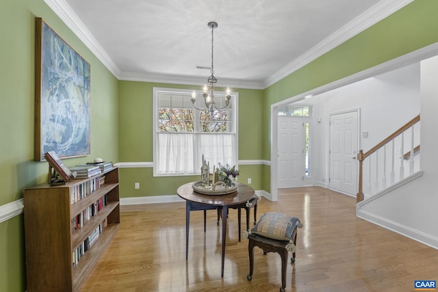 3080 Morewood Ln, Charlottesville, VA 22901 - dining space with a chandelier, wood finished floors, stairway, baseboards, and ornamental molding