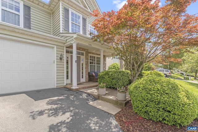 3080 Morewood Ln, Charlottesville, VA 22901 - doorway to property with covered porch and a garage