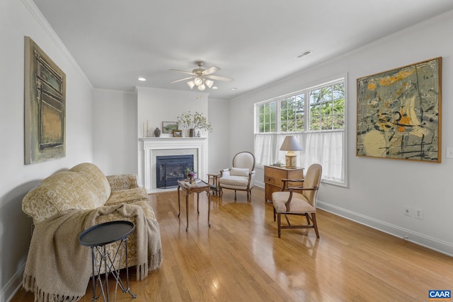 3080 Morewood Ln, Charlottesville, VA 22901 - sitting room featuring ornamental molding, light wood-type flooring, a fireplace, baseboards, and a ceiling fan