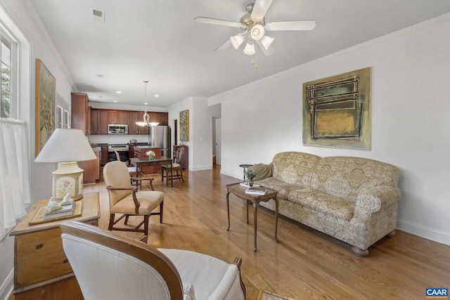 3080 Morewood Ln, Charlottesville, VA 22901 - living room featuring light wood finished floors, baseboards, ceiling fan, recessed lighting, and crown molding