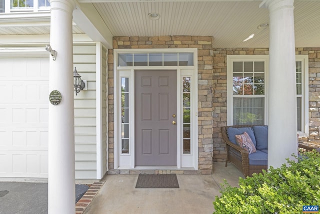 3080 Morewood Ln, Charlottesville, VA 22901 - entrance to property featuring a porch, stone siding, and a garage