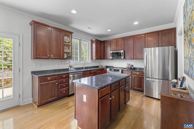 3080 Morewood Ln, Charlottesville, VA 22901 - kitchen with appliances with stainless steel finishes, light wood-style flooring, a sink, dark stone counters, and crown molding