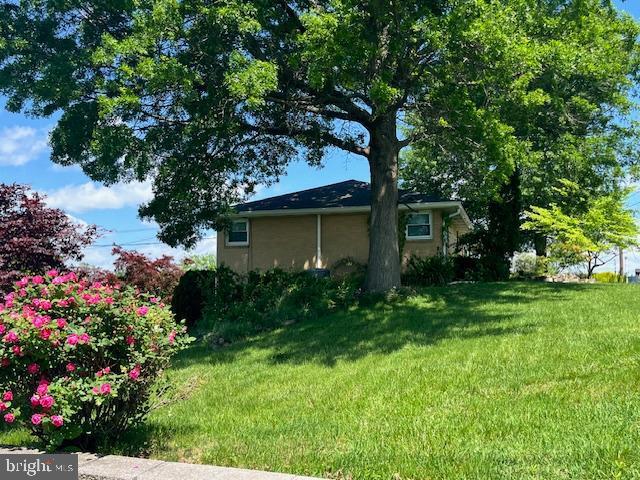 1155 Loop Dr, Harrisburg, PA 17112 - view of property exterior featuring a lawn