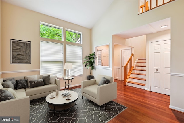 8 Ashford Ct, Annapolis, MD 21403 - living room with high vaulted ceiling, stairs, wood finished floors, and baseboards