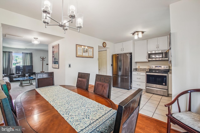 1650 Woodtree Ct E, Annapolis, MD 21409 - dining room with a chandelier and light tile patterned flooring