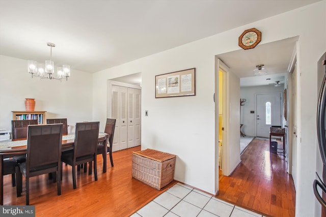1650 Woodtree Ct E, Annapolis, MD 21409 - dining room featuring a chandelier and light wood finished floors